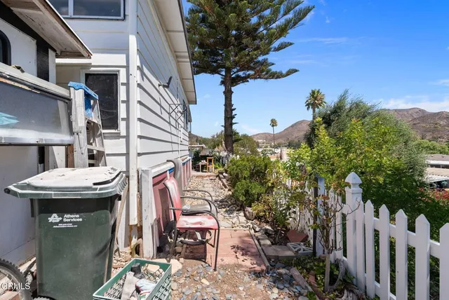 a view of a chairs and table in the patio