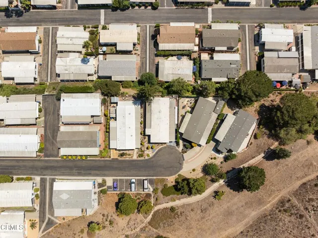 an aerial view of houses with outdoor space