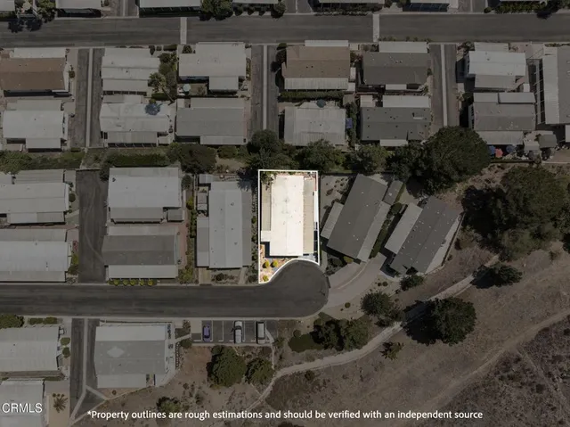 an aerial view of a house with outdoor space