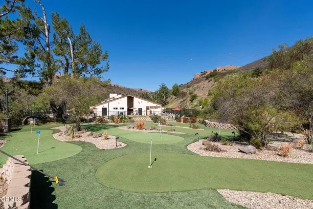 a view of a swimming pool with a yard