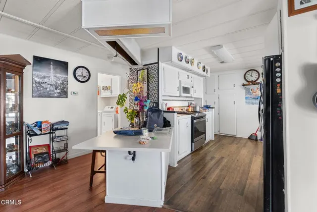 a view of a kitchen and workspace