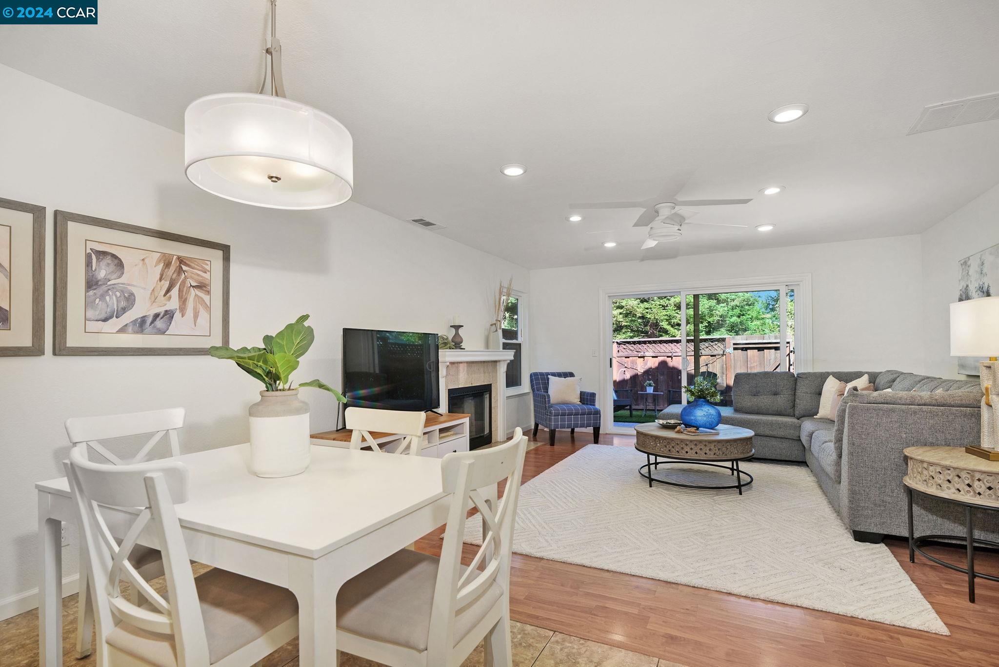 3627 Crow Canyon Road San Ramon, CA 94582 - Photo 1 of 1 a living room with furniture a flat screen tv and a large window