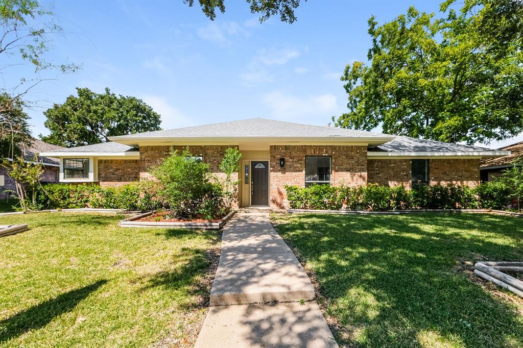 front view of a house with a yard