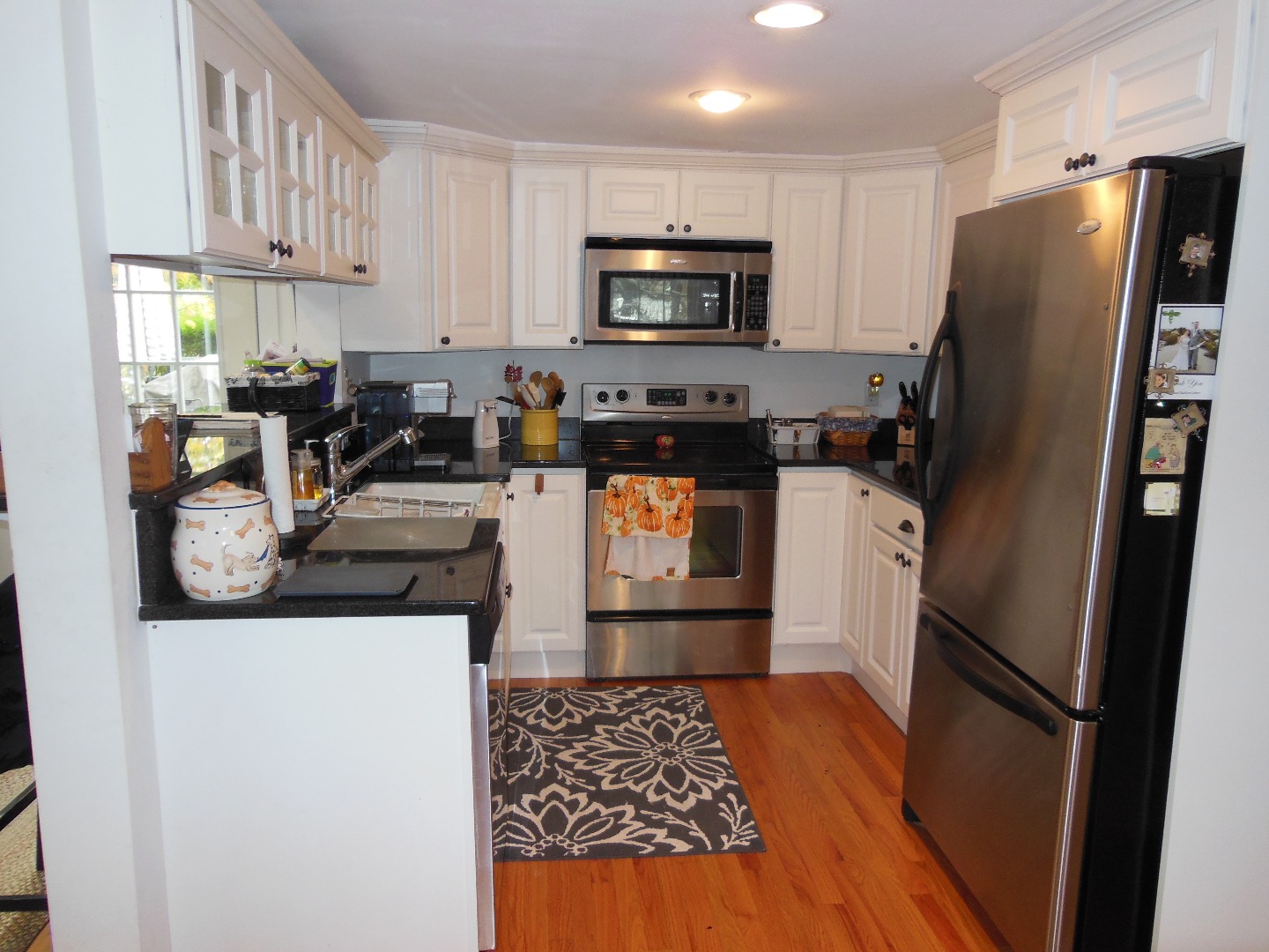 60 West Tisbury Road Edgartown, MA 02539 - Photo 8 of 24 a kitchen with stainless steel appliances a refrigerator a sink a stove a microwave and cabinets
