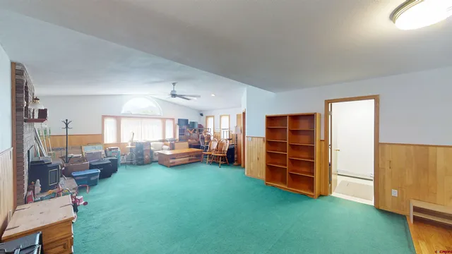 a view of a livingroom with furniture and a window