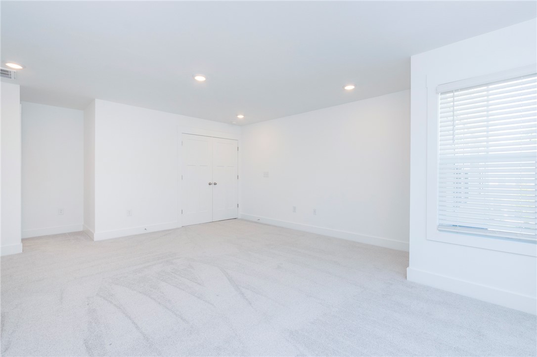 607 WH Kay Lane Anderson, SC 29621 - Photo 34 of 48 A spacious room offers comfortable carpeting and a bright window with horizontal blinds.