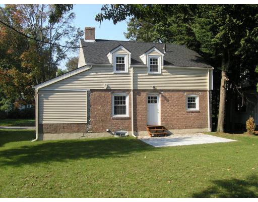 31 Harding Road Lexington, MA 02420 - Photo 15 of 16 a front view of a house with a yard