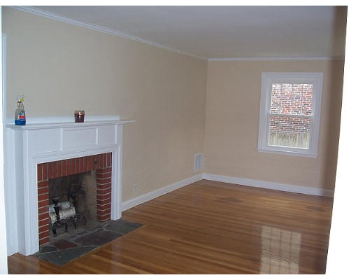 31 Harding Road Lexington, MA 02420 - Photo 4 of 16 a view of an empty room with wooden floor and a fireplace