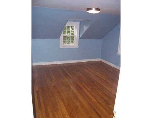 31 Harding Road Lexington, MA 02420 - Photo 10 of 16 a view of an empty room with wooden floor and a window