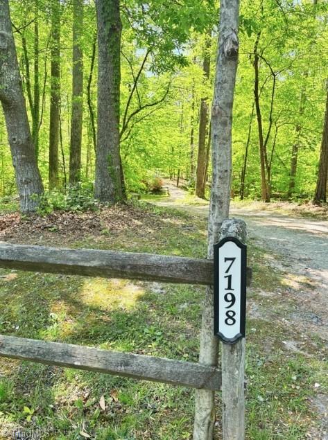7198 Spring Hill Road Lewisville, NC 27023 - Photo 34 of 42 Behind the split rail fence is your hidden oasis