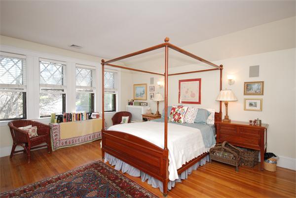 51 Winthrop Road, Unit 2 Brookline, MA 02445 - Photo 16 of 20 a bedroom with a bed couch and a large window