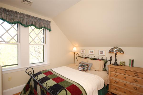 51 Winthrop Road, Unit 2 Brookline, MA 02445 - Photo 18 of 20 a bedroom with a bed and a window