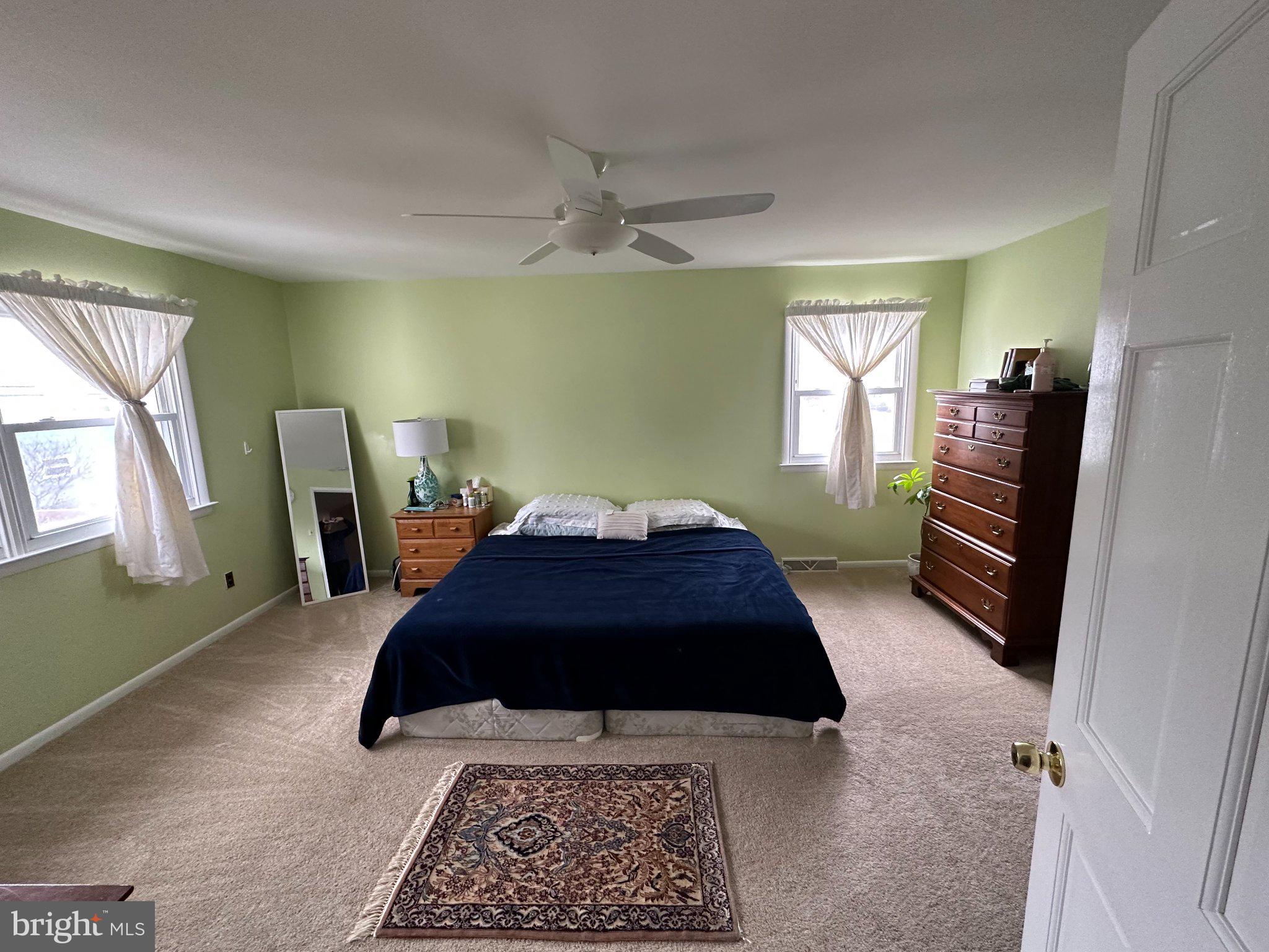 321 Surrey Road Cherry Hill, NJ 08002 - Photo 10 of 24 a bedroom with a bed lamp and a dresser