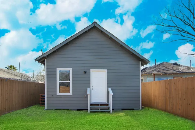 a view of a backyard with potted plants