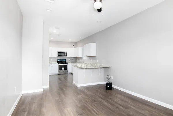 a view of kitchen with sink and window