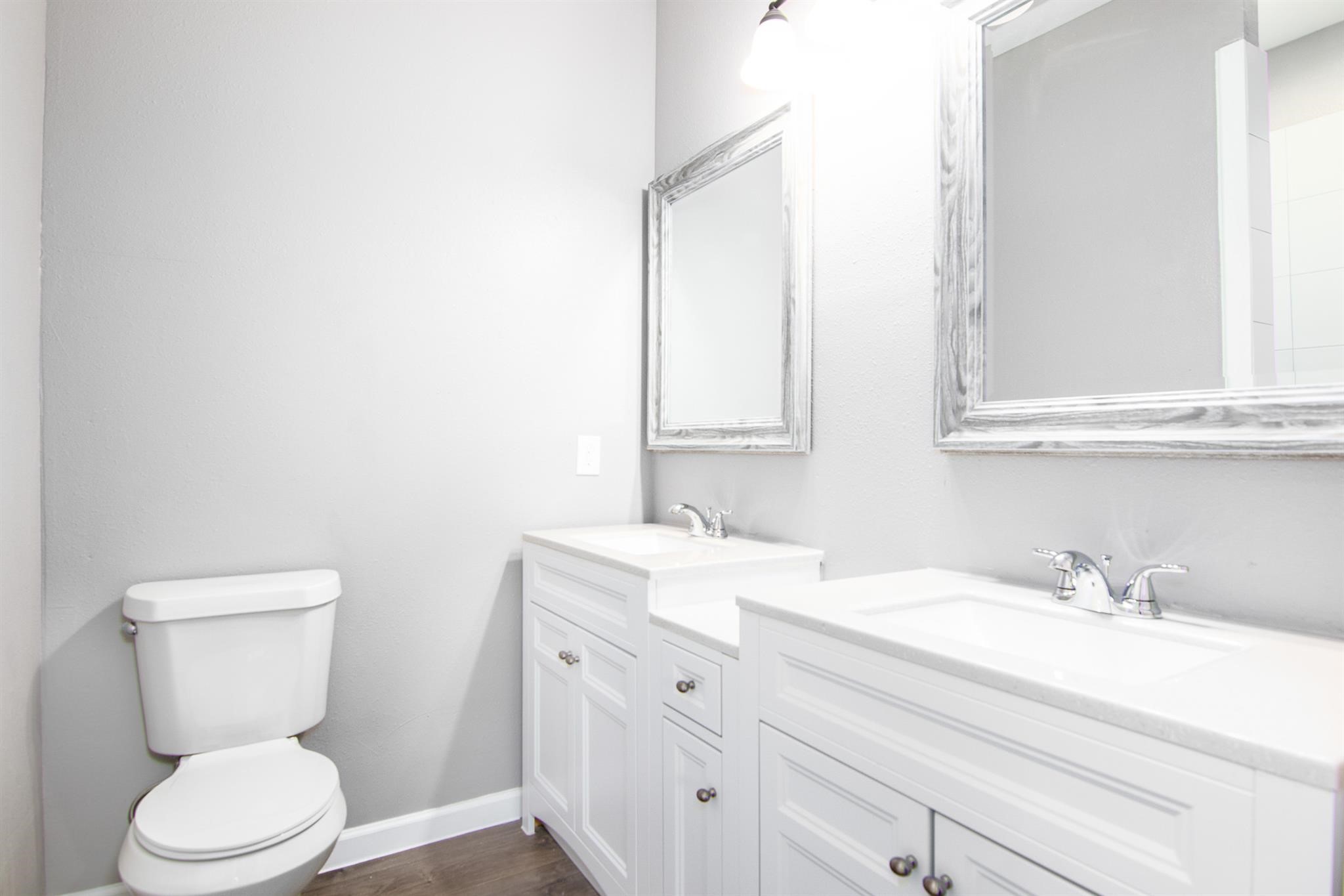 1709 Stevens Street Houston, TX 77026 - Photo 9 of 17 a bathroom with a toilet sink and mirror