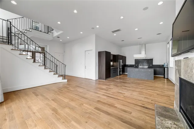 a view of kitchen with refrigerator microwave and cabinets