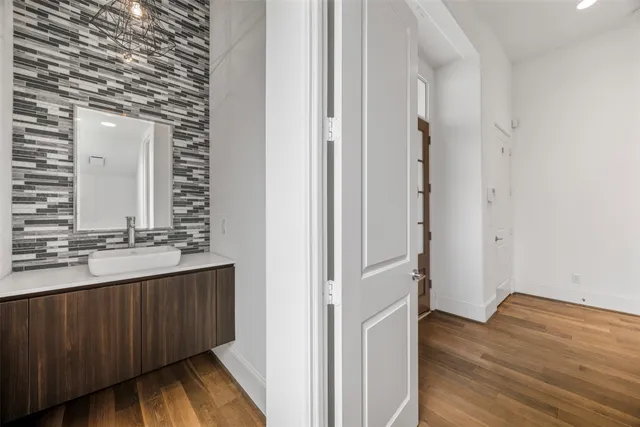 a bathroom with a double vanity sink and a mirror