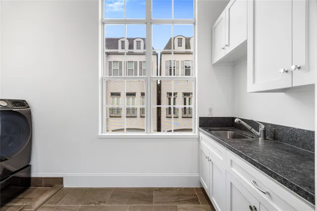 a kitchen with a sink and cabinets