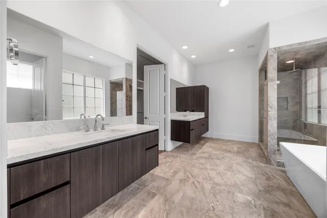 a large bathroom with a sink and a mirror