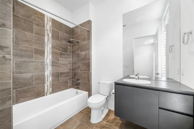 a view of staircase with railing and white walls