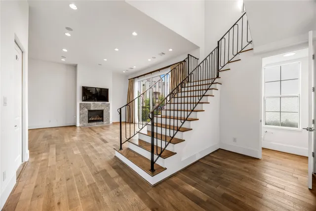 a view of entryway with wooden floor and stairs