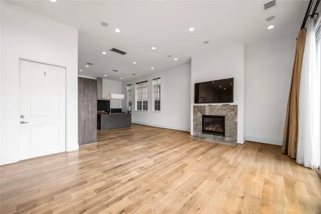 a view of a kitchen with a sink and a fireplace