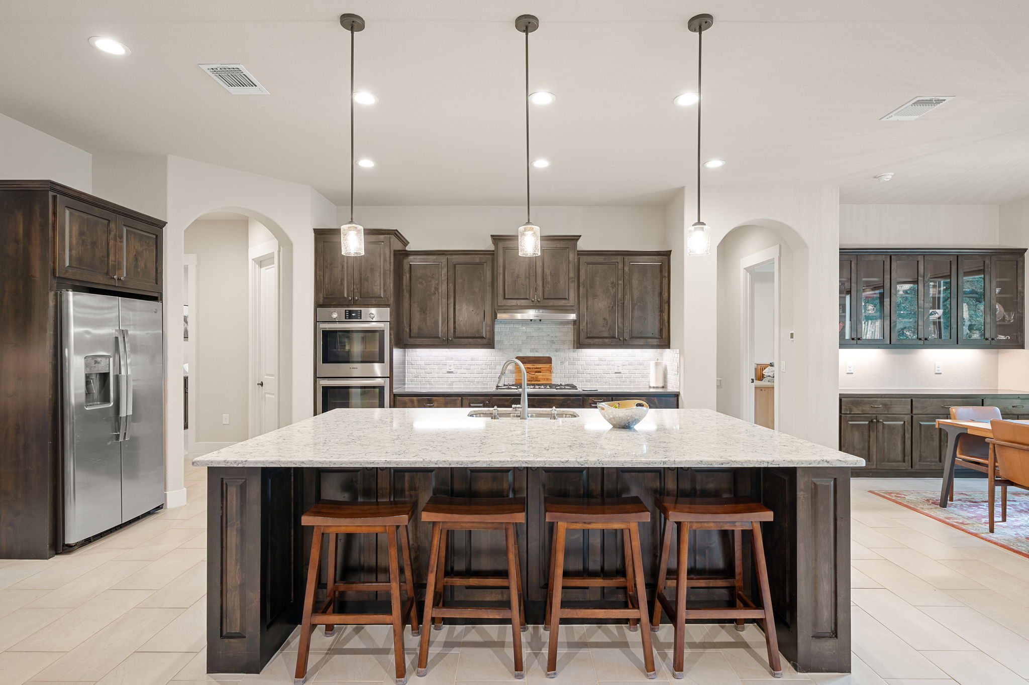 212 Marbella Way Georgetown, TX 78633 - Photo 10 of 40 a large kitchen with a table and chairs