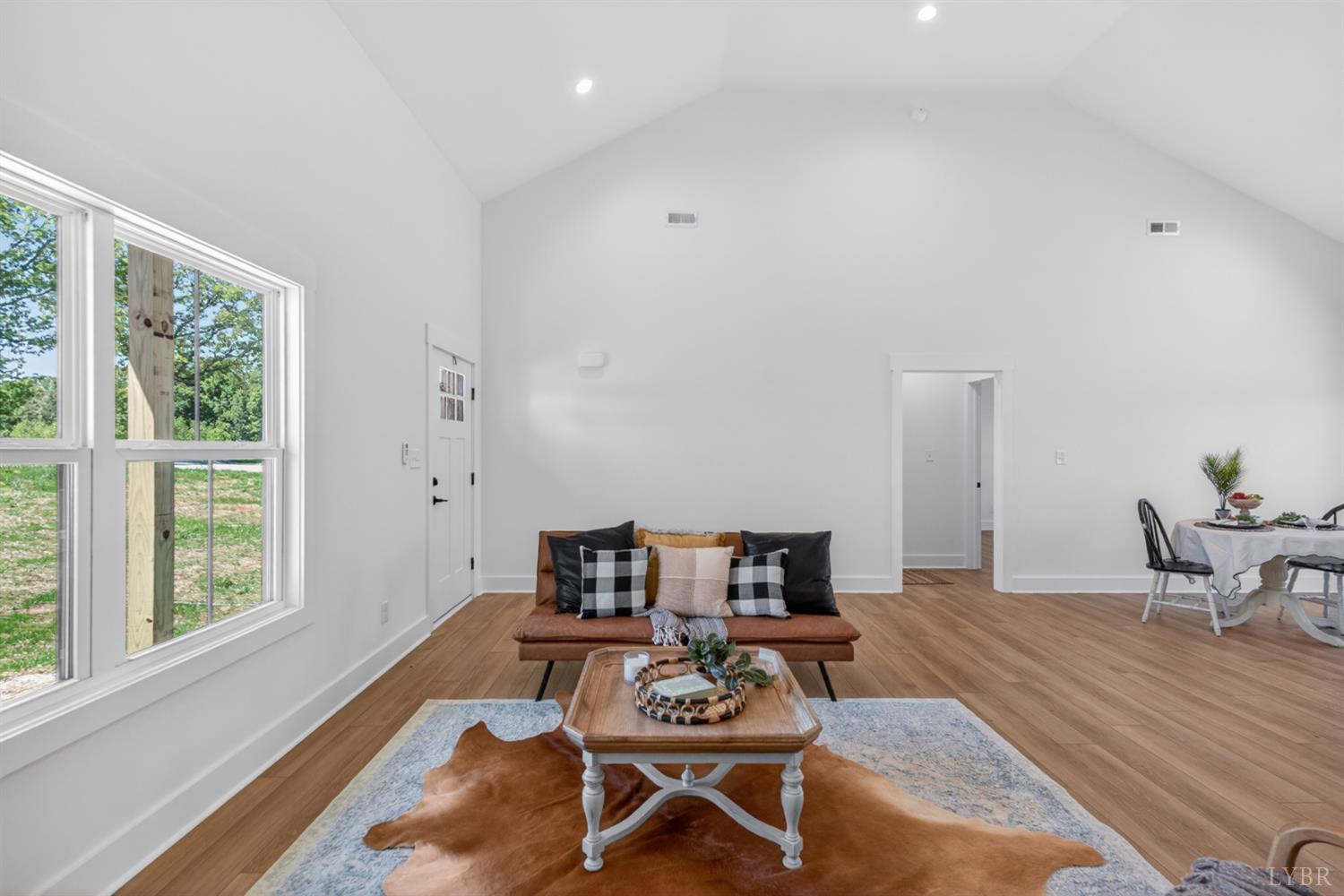 20 Fox Hall Drive Amherst, VA 24521 - Photo 12 of 46 a living room with furniture a rug potted plant and a large window