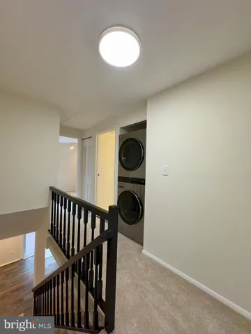 a view of hallway with washer and dryer