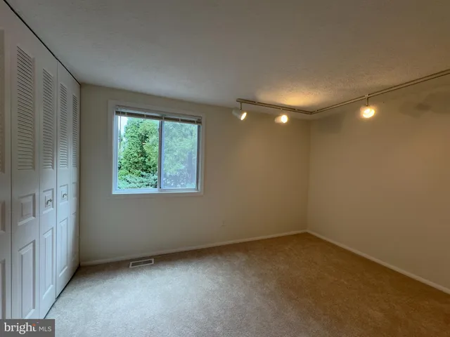 an empty room with a empty space and a window