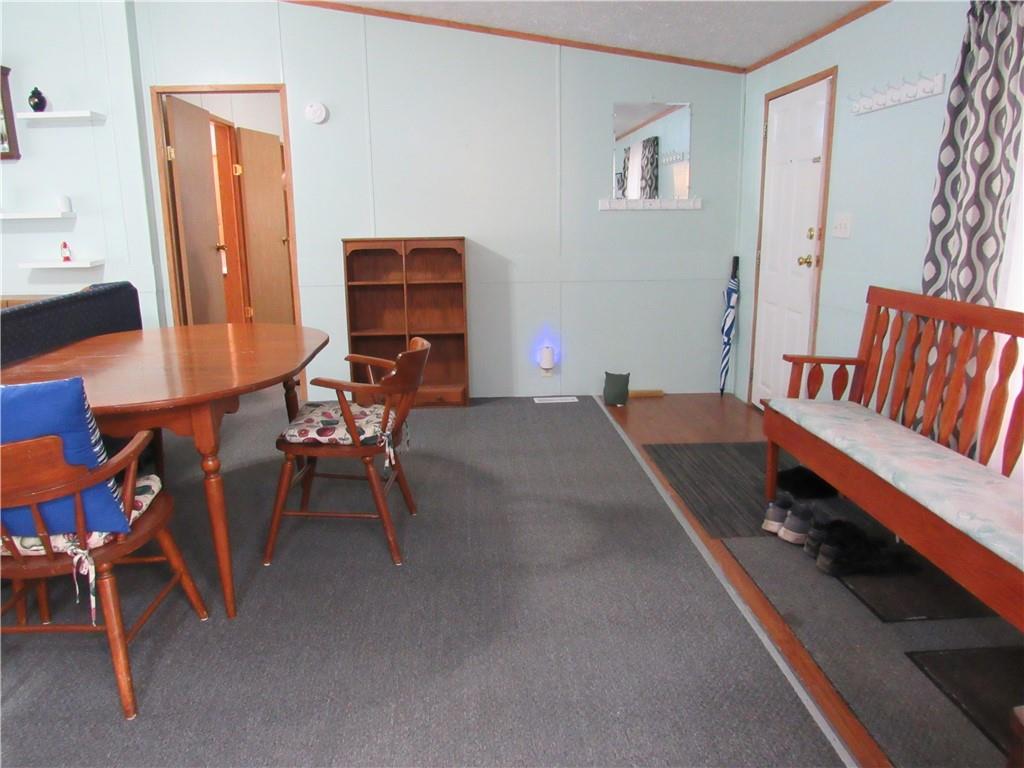 719 Joy Lane Butler, PA 16001 - Photo 13 of 36 a balcony with chairs and with wooden floor
