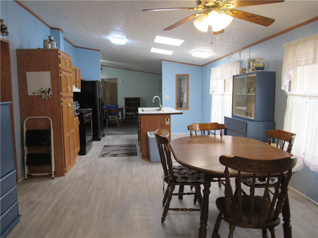 719 Joy Lane Butler, PA 16001 - Photo 18 of 36 a view of a dining room with furniture and chandelier