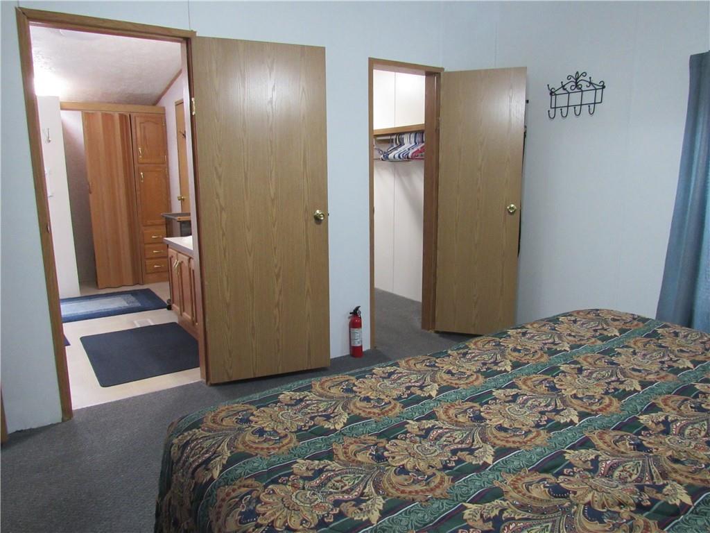 719 Joy Lane Butler, PA 16001 - Photo 23 of 36 a bedroom with a bed and a mirror