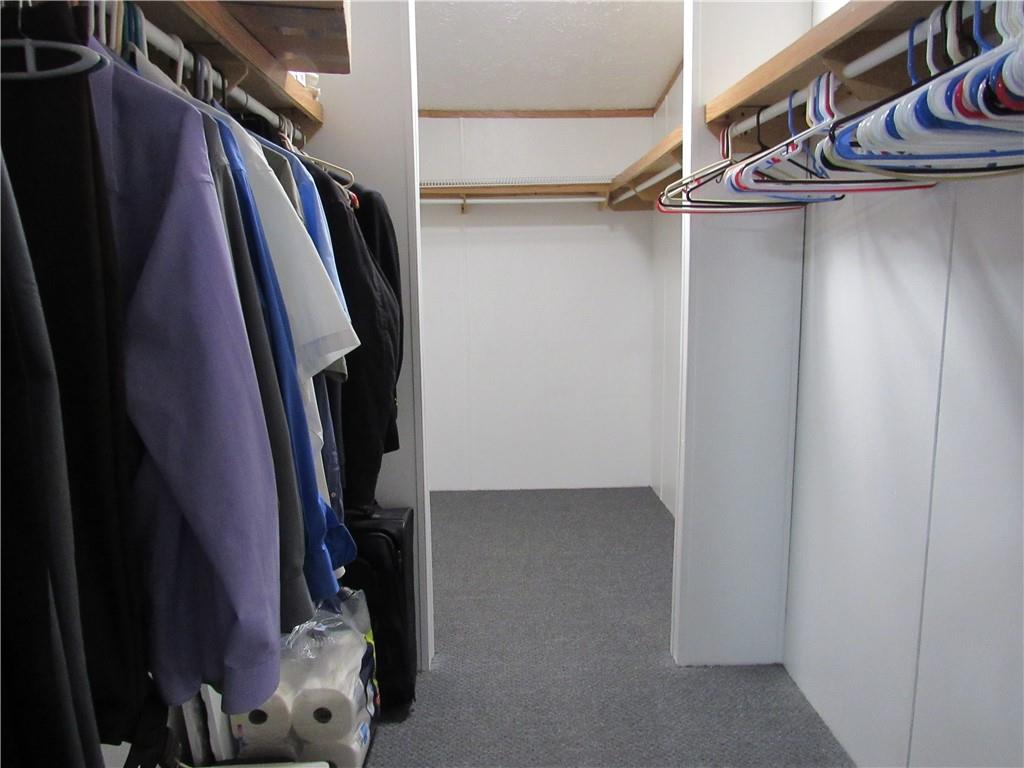 719 Joy Lane Butler, PA 16001 - Photo 25 of 36 a view of walk in closet with clothes and shoes