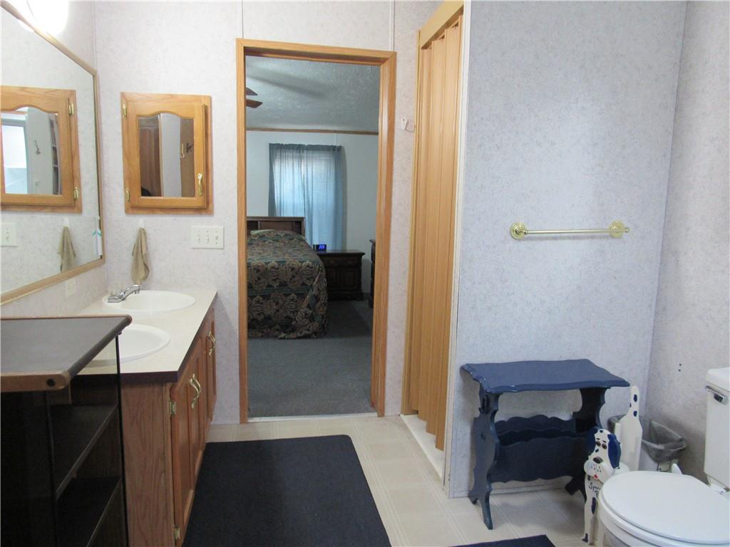 719 Joy Lane Butler, PA 16001 - Photo 29 of 36 a bathroom with a sink a toilet and shower