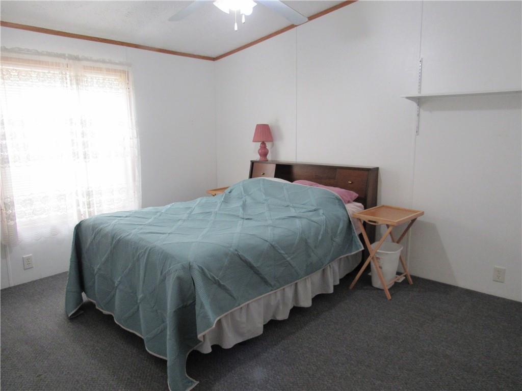 719 Joy Lane Butler, PA 16001 - Photo 31 of 36 a bed sitting in a bedroom next to a window