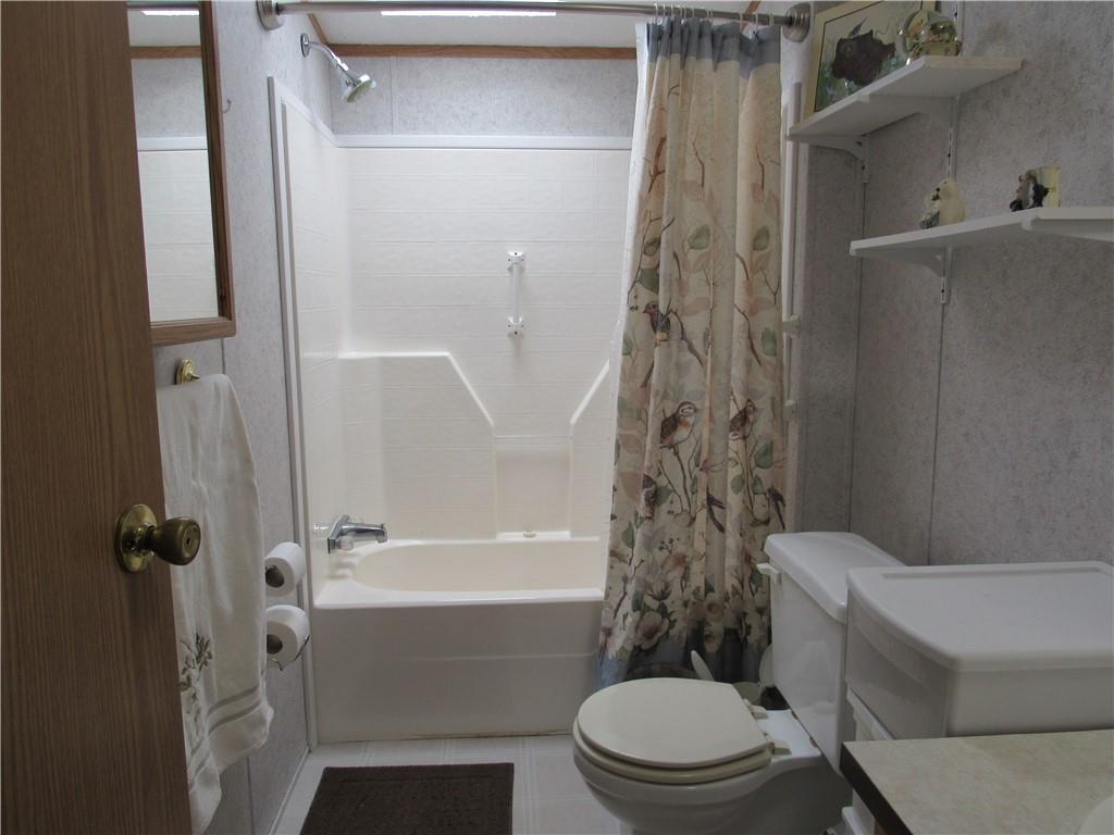 719 Joy Lane Butler, PA 16001 - Photo 34 of 36 a bathroom with a toilet and a shower