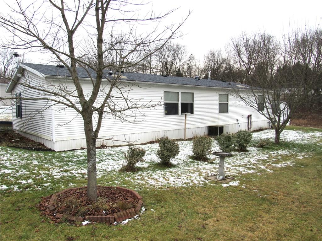 719 Joy Lane Butler, PA 16001 - Photo 4 of 36 a backyard of a house with table and chairs