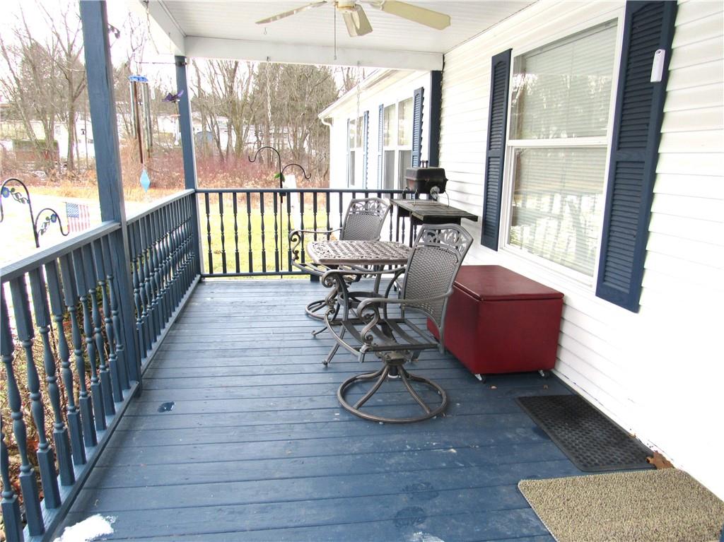 719 Joy Lane Butler, PA 16001 - Photo 8 of 36 a view of a dining room with furniture a chandelier and wooden floor