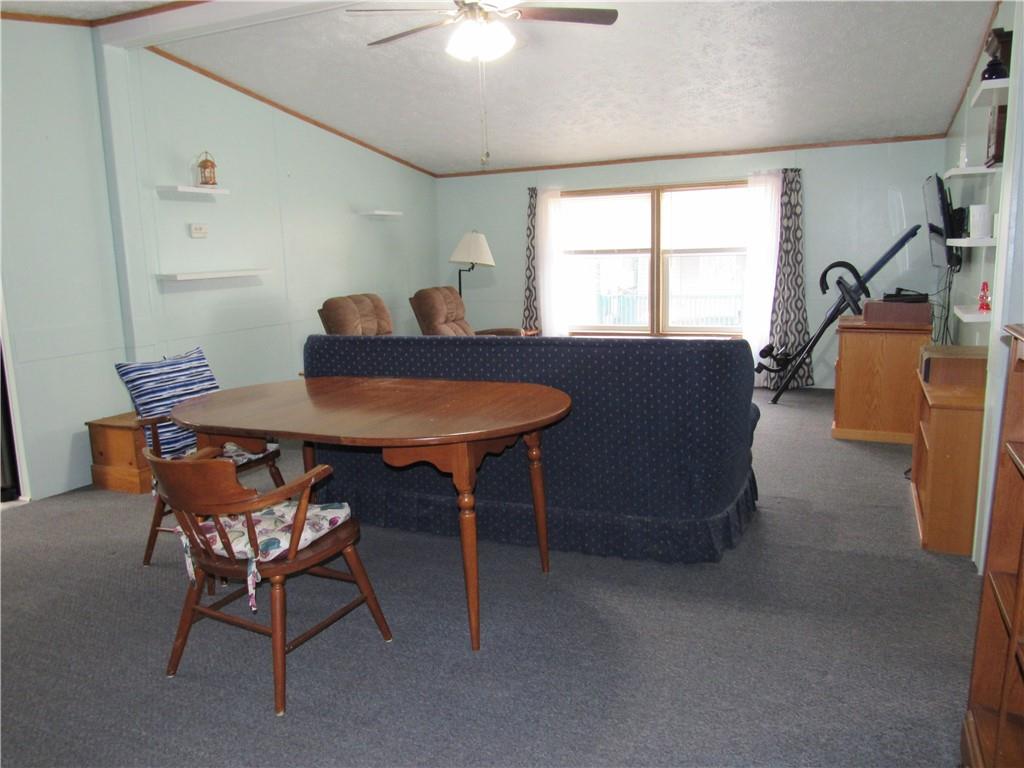 719 Joy Lane Butler, PA 16001 - Photo 10 of 36 a living room with furniture and a window