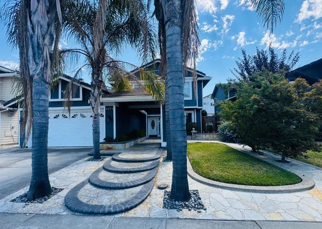 a view of a house with a swimming pool