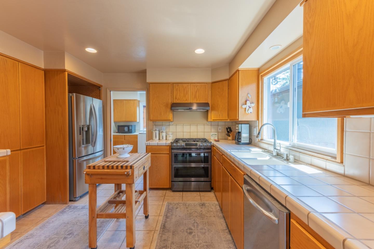 2 Merrill Way Carmel Valley, CA 93924 - Photo 14 of 43 a kitchen with stainless steel appliances a stove sink and refrigerator