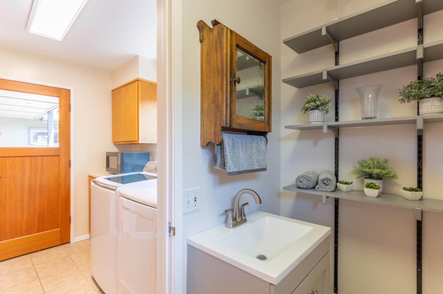 2 Merrill Way Carmel Valley, CA 93924 - Photo 17 of 43 a bathroom with a sink and a mirror