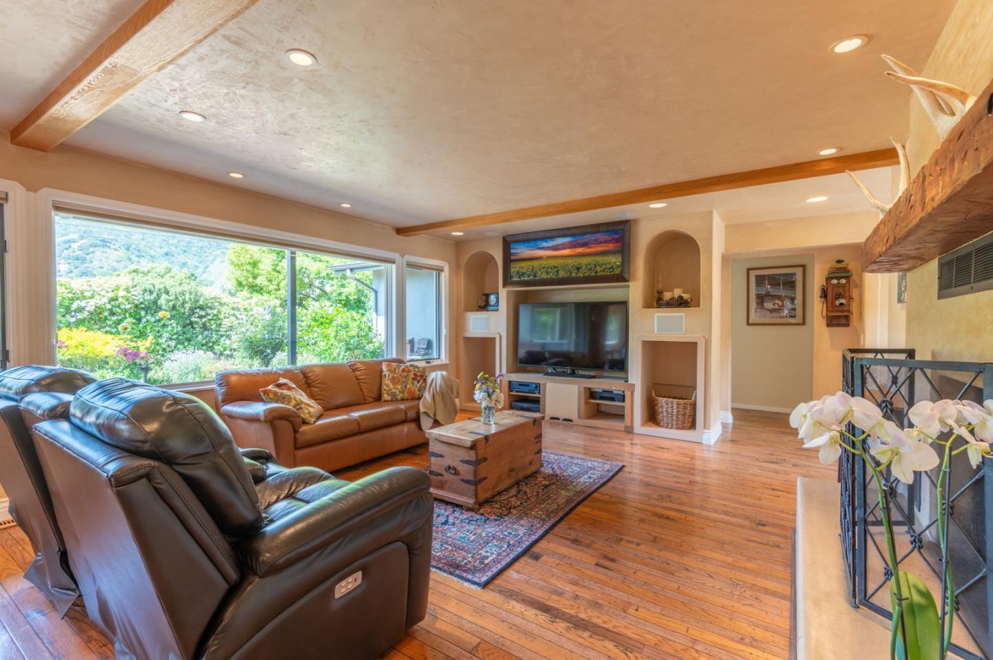 2 Merrill Way Carmel Valley, CA 93924 - Photo 9 of 43 a living room with furniture tv and a large window