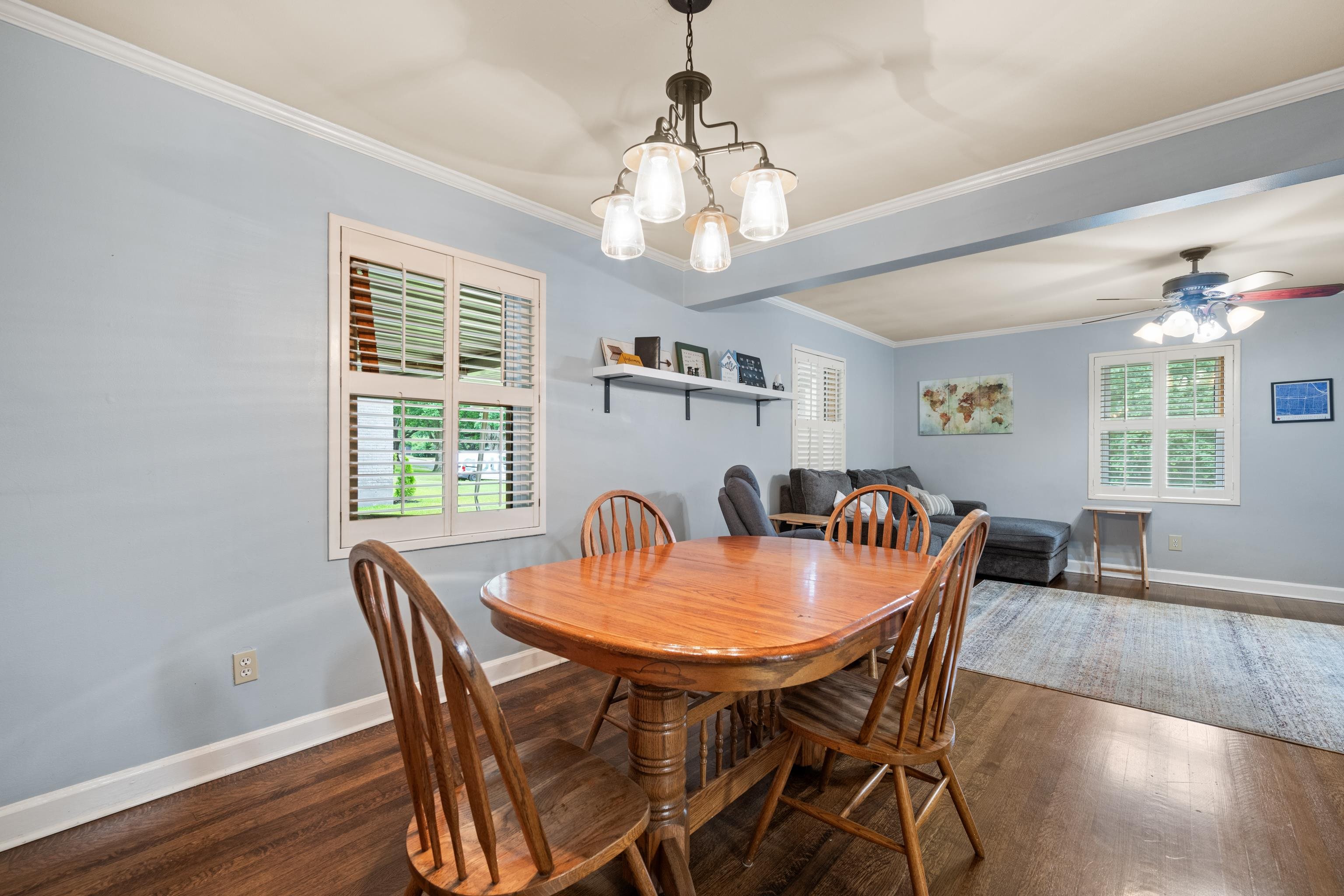 4470 Princeton Road Memphis, TN 38117 - Photo 5 of 32 a dining room with furniture a chandelier and wooden floor