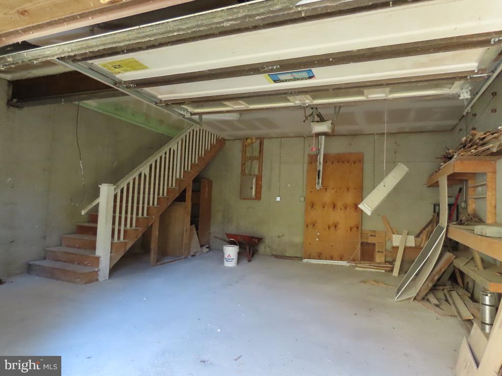 172 Keyser Run Road Washington, VA 22747 - Photo 23 of 36 Garage and stairs to the main level