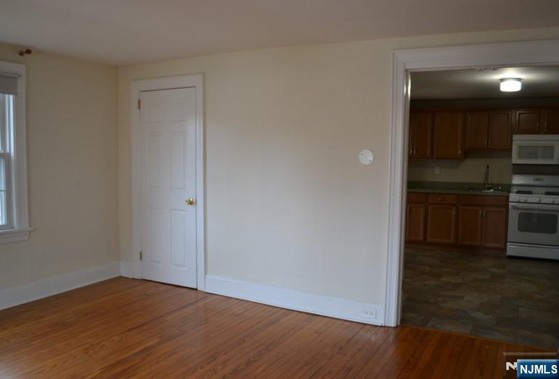 192 West Midland Avenue, Unit 1 Paramus, NJ 07652 - Photo 11 of 14 a view of a kitchen with wooden floor and electronic appliances