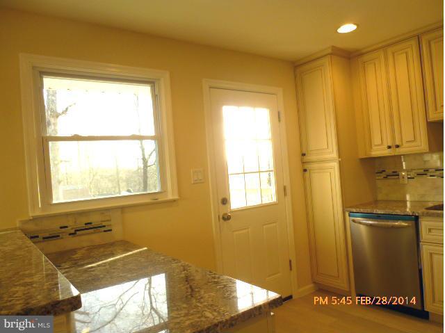7935 Ellet Road Springfield, VA 22151 - Photo 8 of 30 a bathroom with a tub and shower