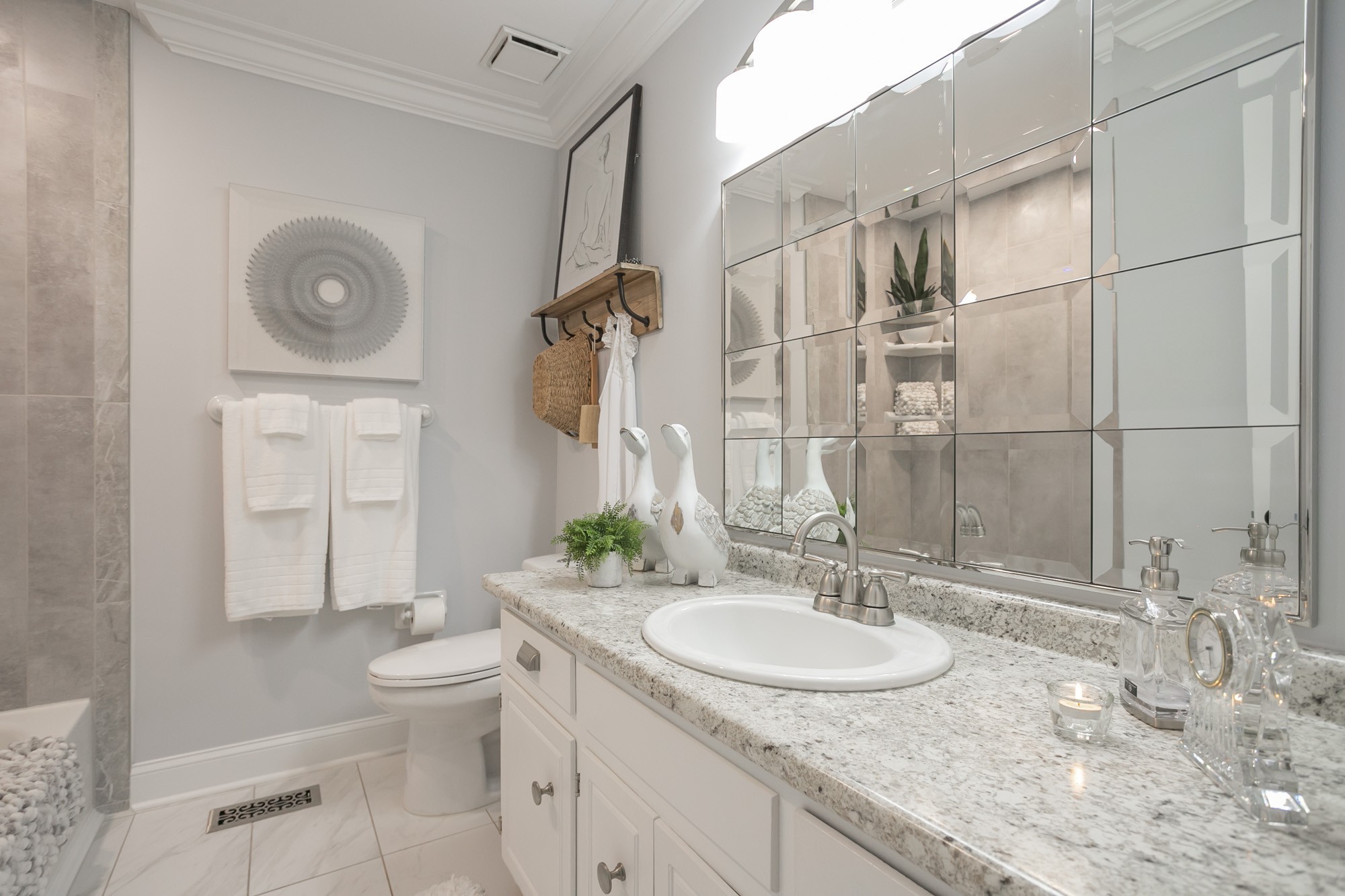 3005 Country Meadow Road Antioch, TN 37013 - Photo 15 of 20 Hall bath, has shower tub combo, tile flooring and large vanity. (picture taken from previous staging)